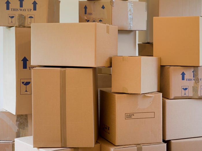 Why are moving boxes preferred over cardboard boxes?